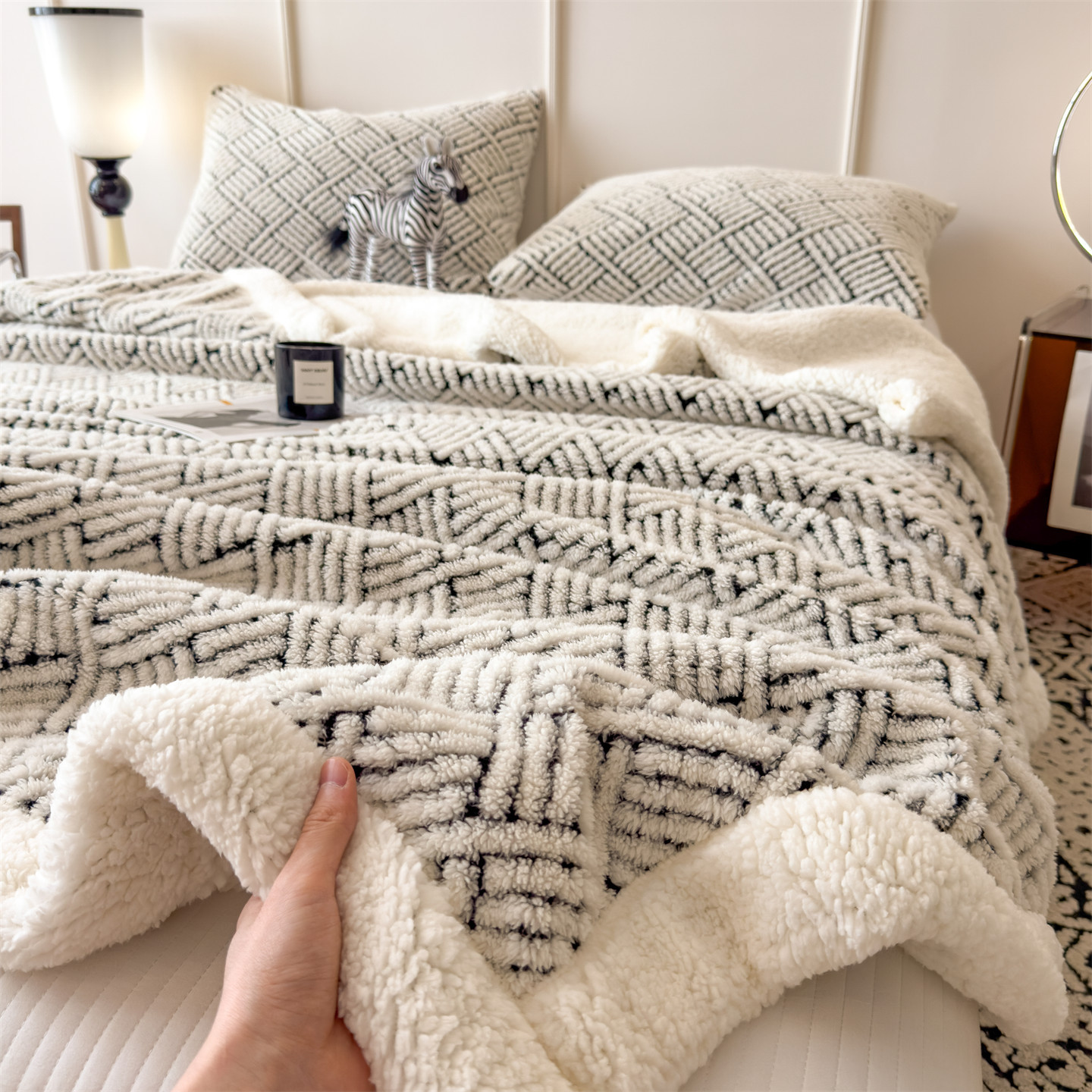 Patterned cozy blanket with lamb fleece look