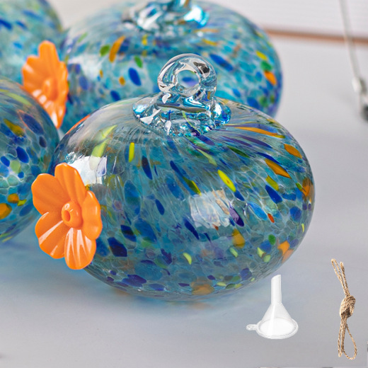Hanging bird feeder and water station made of glass