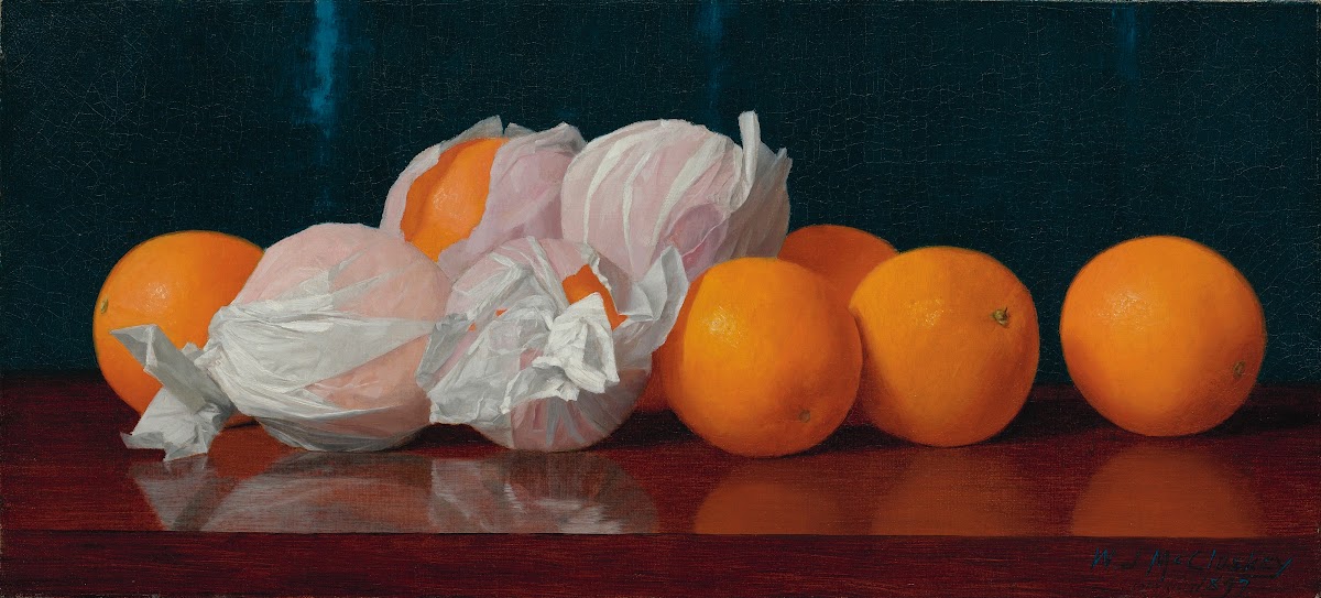 Wrapped Oranges On A Tabletop