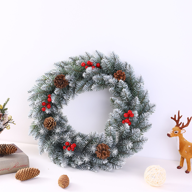 Christmas wreath with berries and pine cones