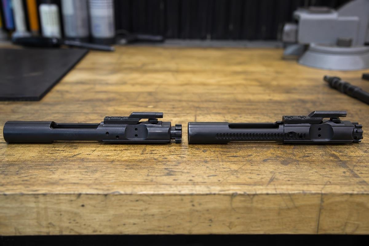 full auto vs semi auto BCG comparison showing carrier tail mass difference