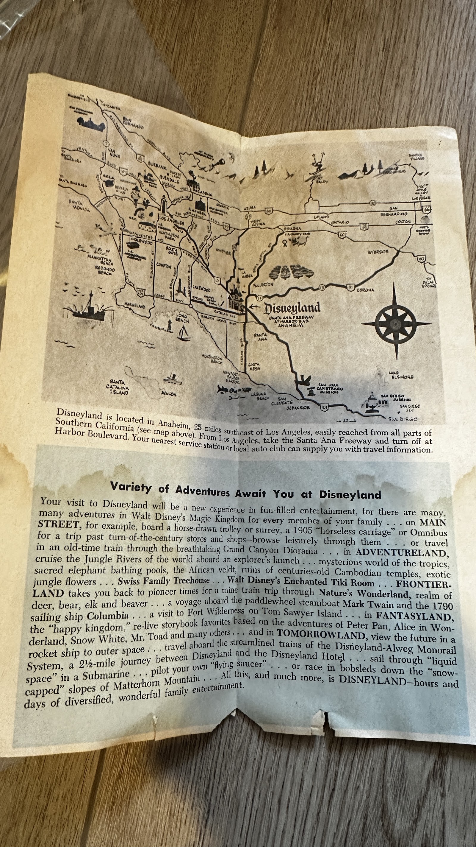 Vintage Disneyland fold-out pictorial map and guide brochure from circa 1963–1965, showing age-toning and central fold, with Southern California map panel
