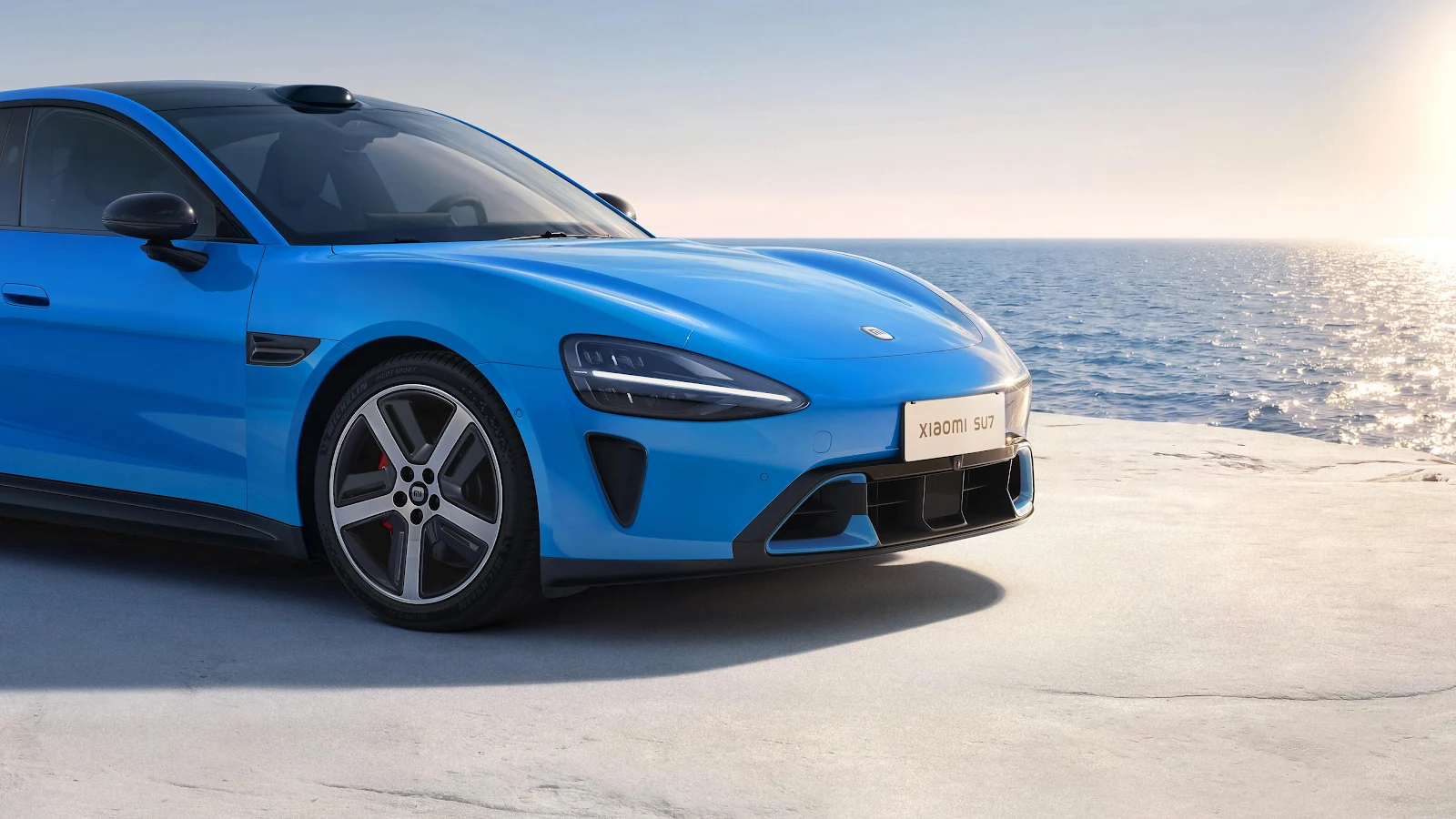 Blue Xiaomi SU7 Near Ocean - Automotive Photography 4K Wallpaper (3840x2160)