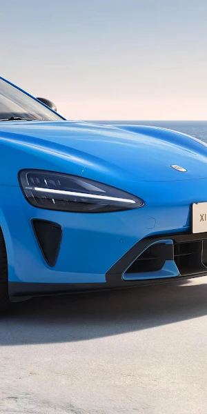 Blue Xiaomi SU7 Near Ocean 4K Wallpaper Background