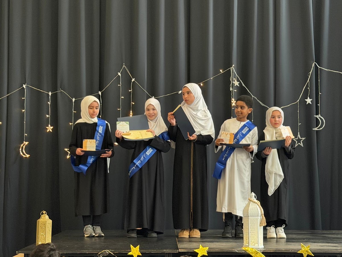 Girls receiving awards at the Ramadan celebration