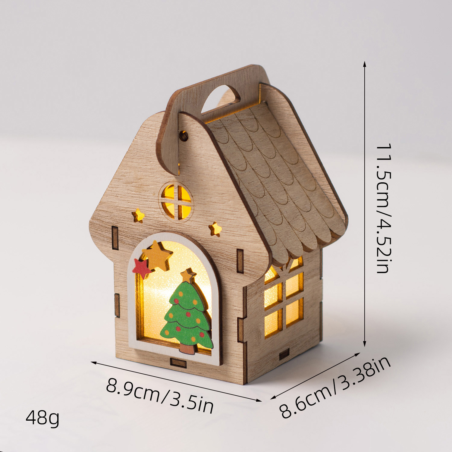 Illuminated wooden house as Christmas decoration