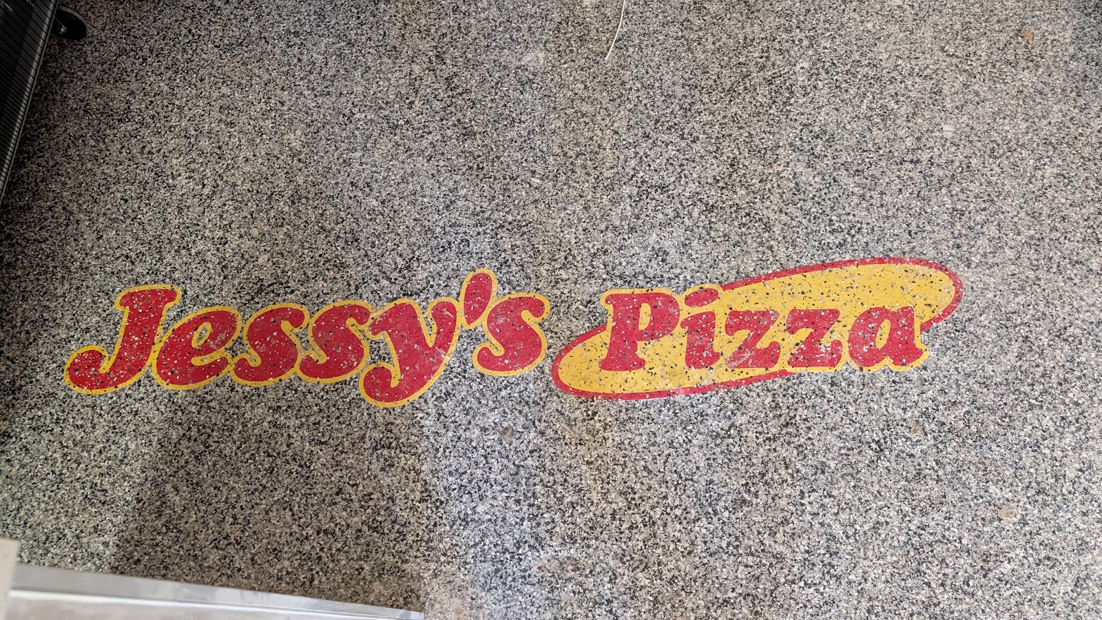 Jessy's Pizza floor logo