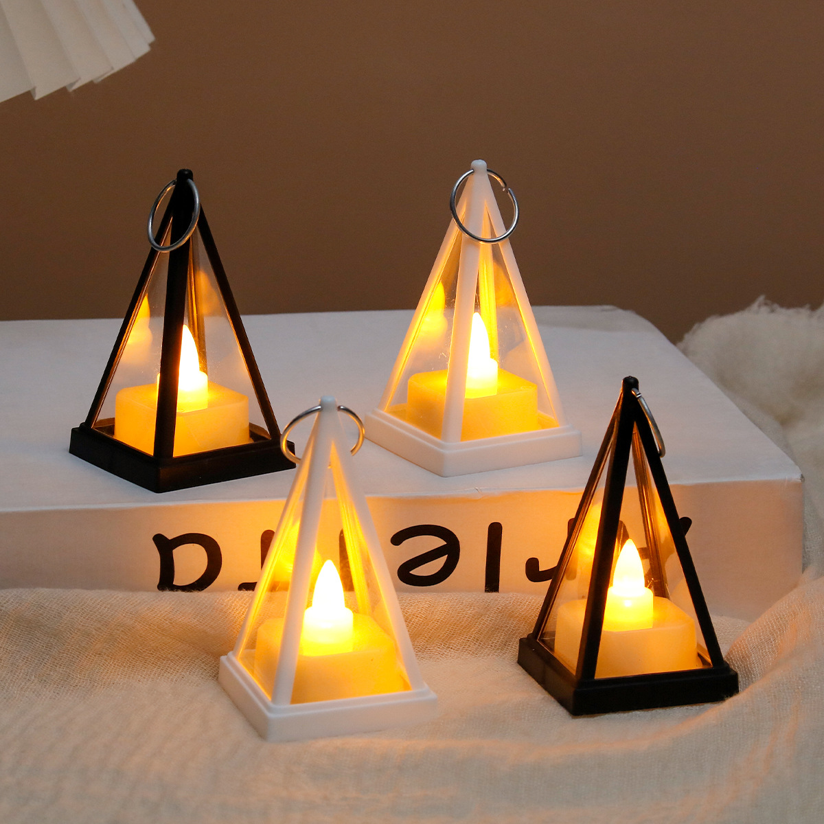 Decorative LED lantern in triangular design for festive occasions