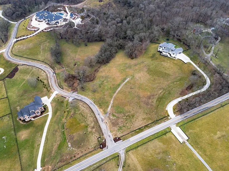 Aerial view of the Brookland project area in West Tennessee, showing large residential lots, winding driveways, and wooded borders.