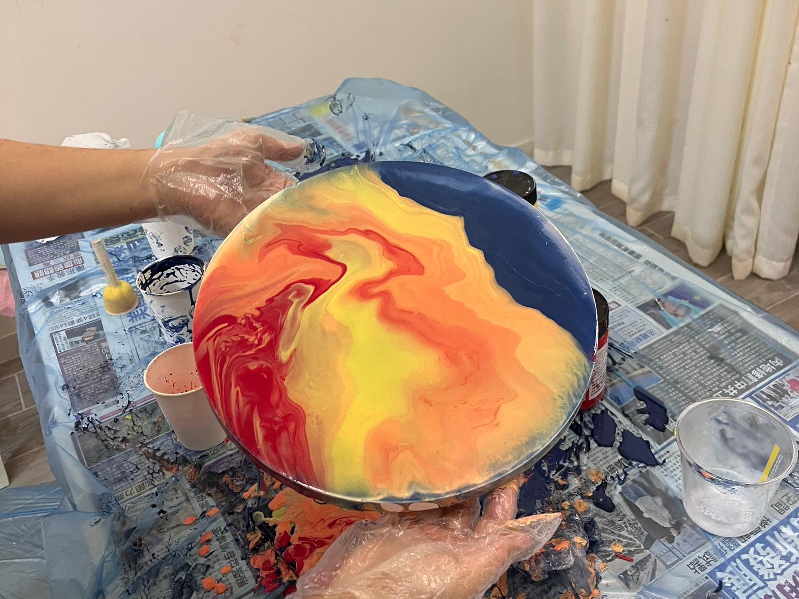 Hands working on a craft project.