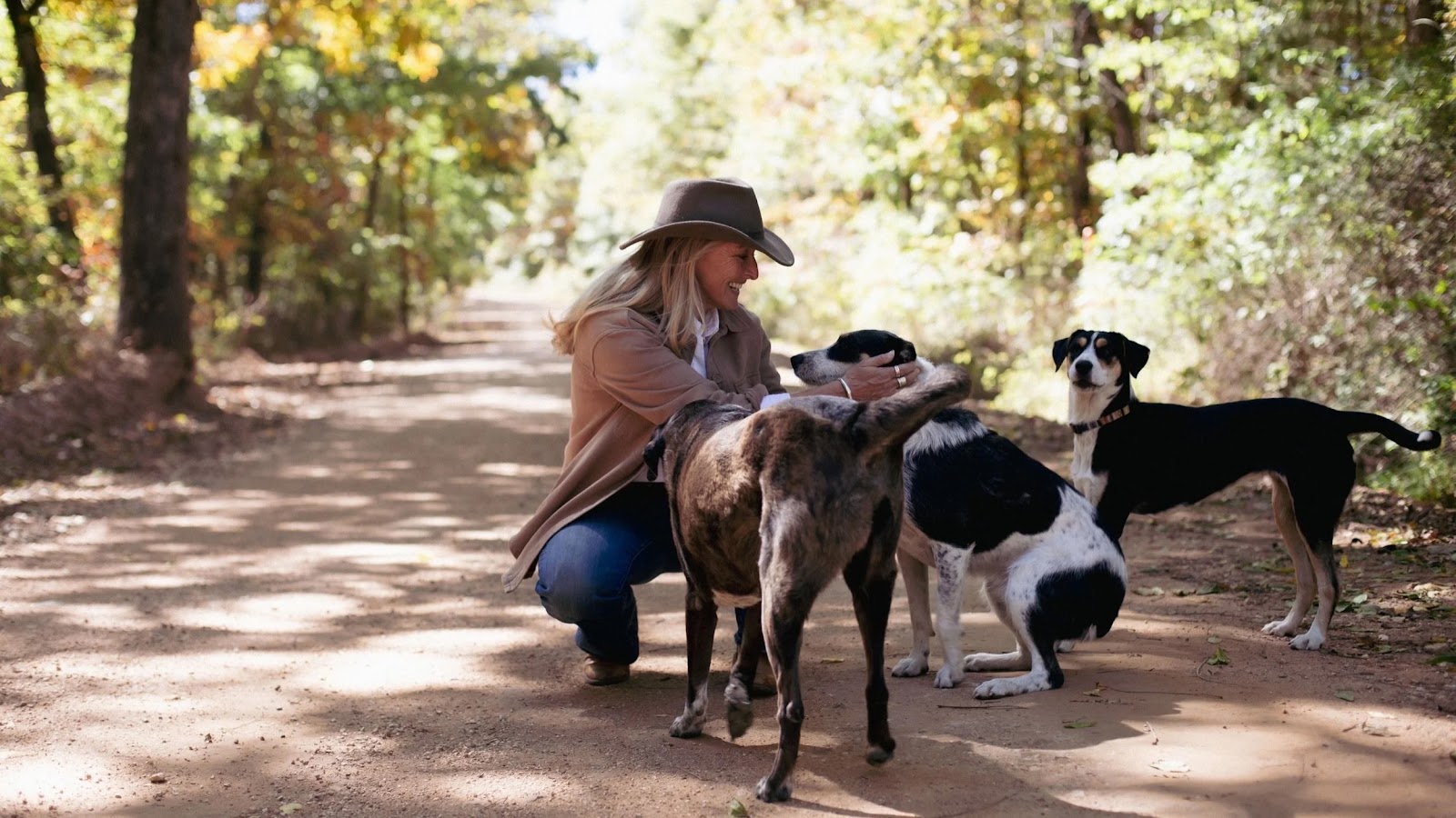 Holly petting her dogs