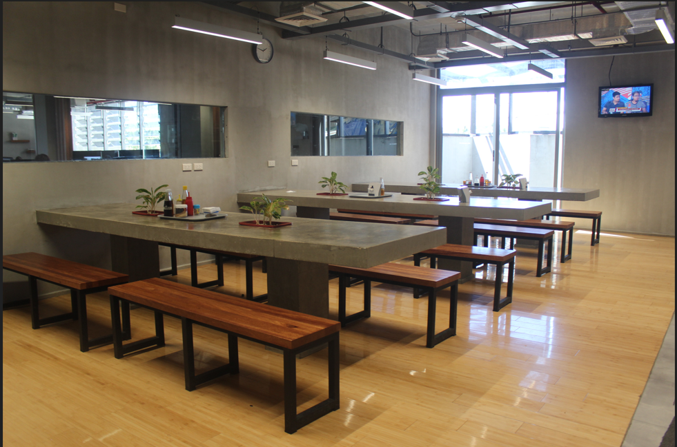 Industrial style office cafeteria with brick walls