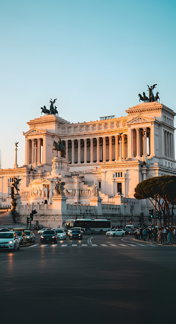 Vittoriano Monument in Rome at Sunset with Golden Light on the White Marble - Free mobile Wallpaper