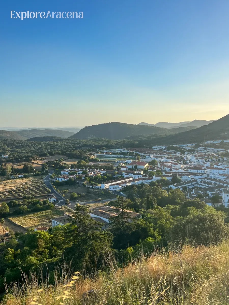 Panoramic view of Aracena from the top of Castillo de Aracena overlooking rooftops and hills