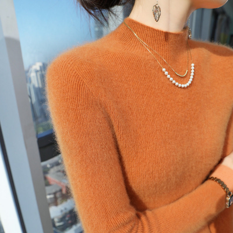Women's knitted sweater with a standing collar, figure-hugging