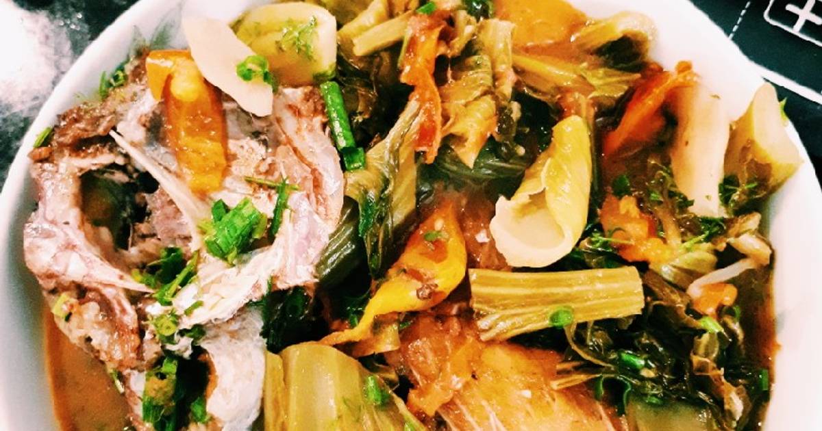 Canh đầu cá nấu dưa chua