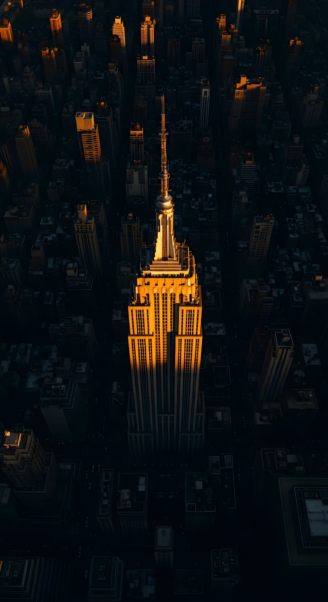 High Angle View of Golden Empire State Building at Sunset - Free 4K mobile Wallpaper