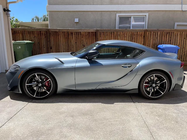 Silver sports car parked outside