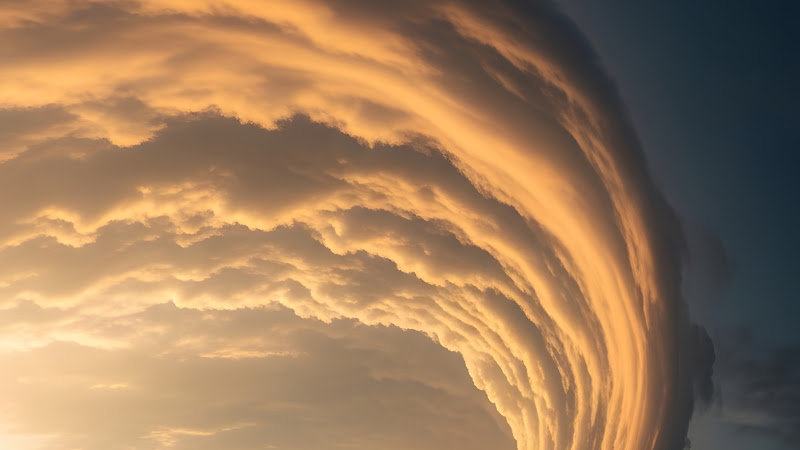 Dramatic Shelf Cloud Over Straight Road and Green Fields