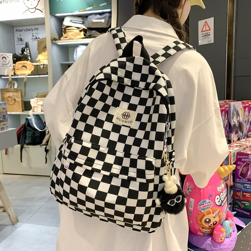 Backpack with letter pattern, 20–35 L