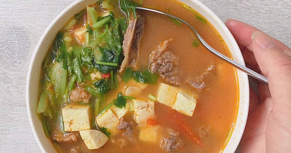 Canh bò nấu đậu chua cay