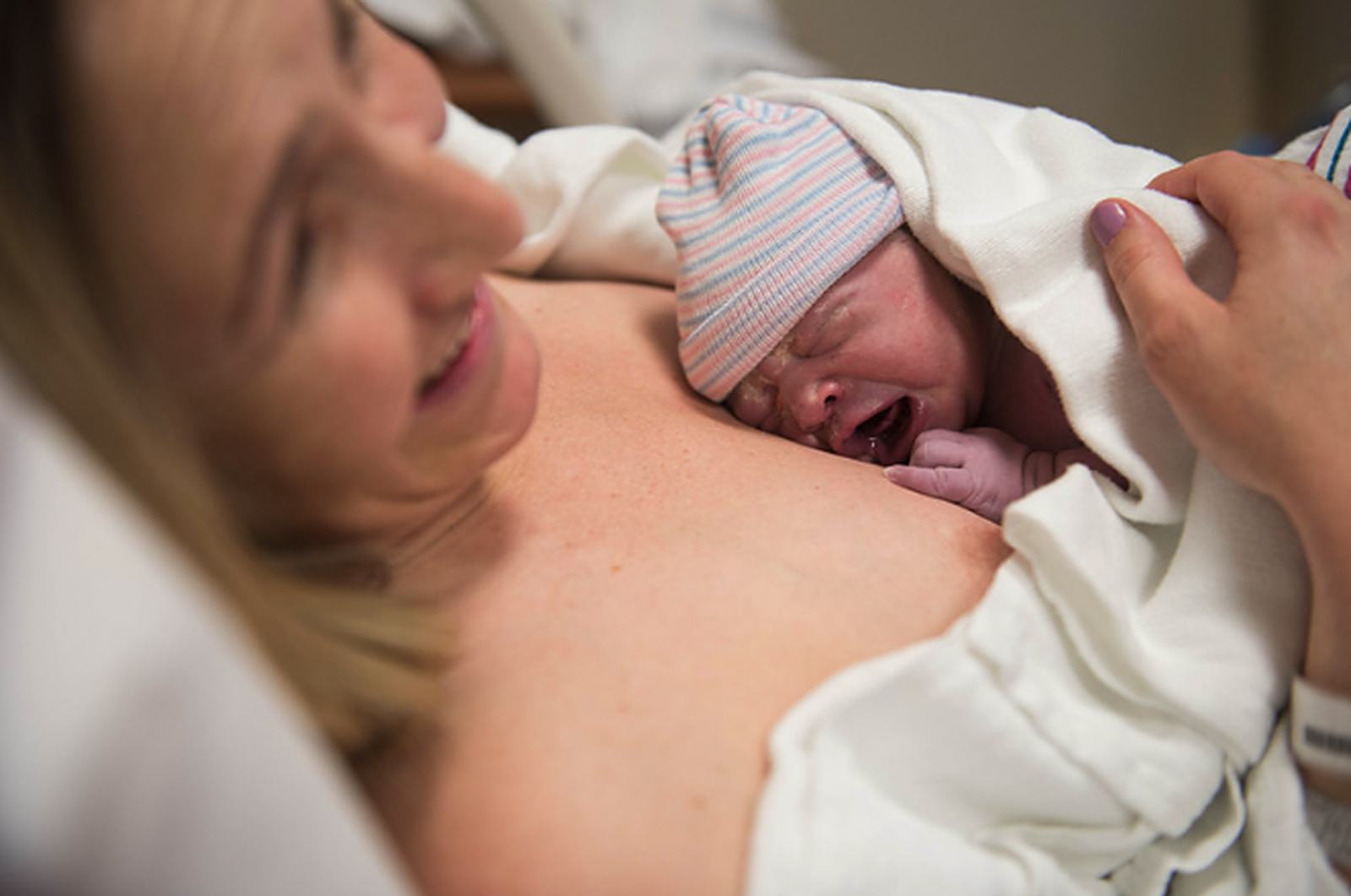 A parent and baby, preparing for feeding before birth