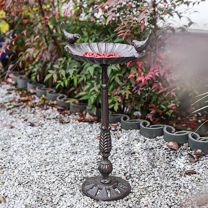 Antique cast iron birdbath on stand