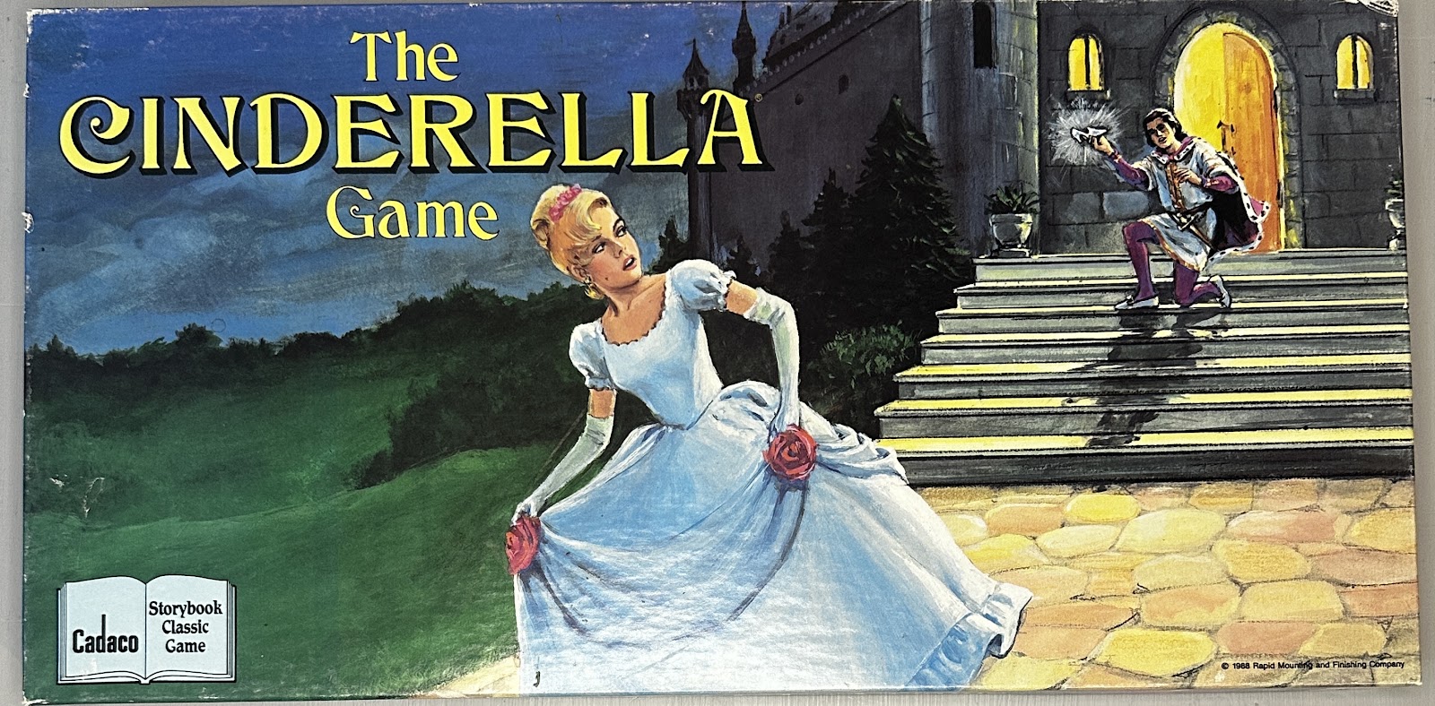 Box cover of Cadaco's 1988 The Cinderella Game, with painted artwork of Cinderella's midnight escape from the ball