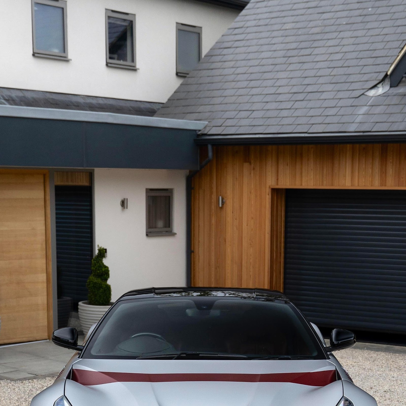 Download Silver Ferrari F12tdf In Driveway 4K iPhone