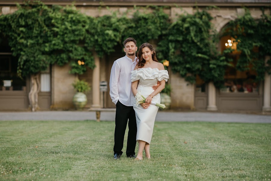 Couple beneath ivy-draped garden arches — Newport RI wedding