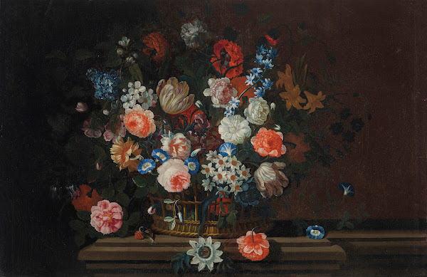 Flowers in a wicker basket on a stone ledge