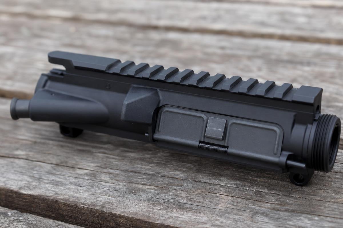 AR-15 upper receiver components including feed ramps and handguard interface