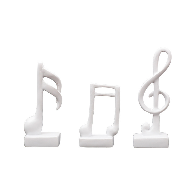 Three music note figures, resin, modern