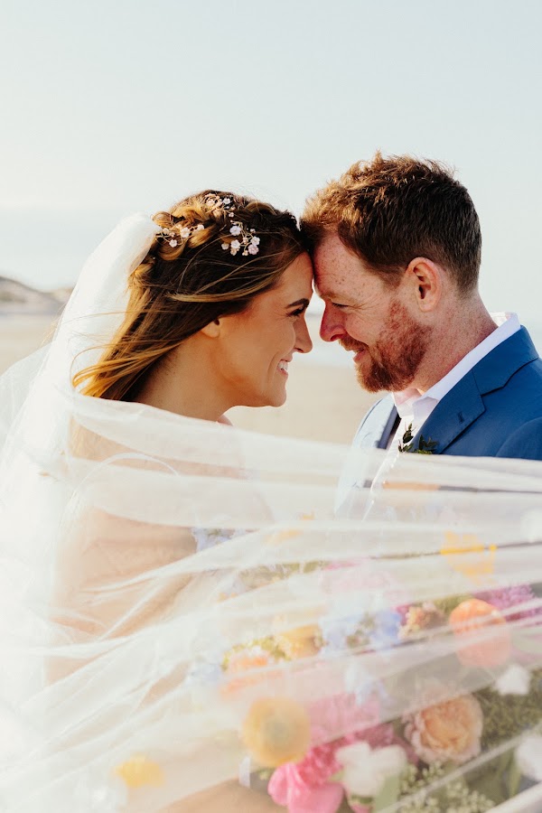 Bride and groom, foreheads together