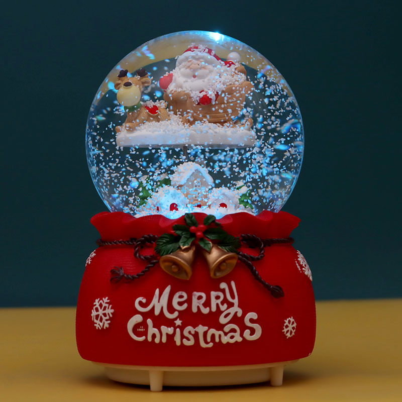 Weihnachtliche Schneekugel mit Musik und Licht