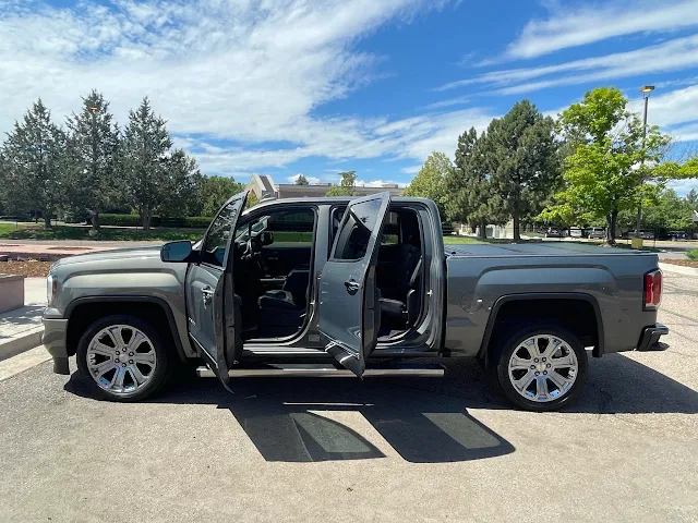 Gray pickup truck with doors open