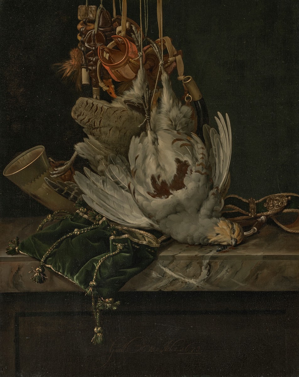 A partridge a hunting horn hawking hoods and a gold trimmed green velvet hunting