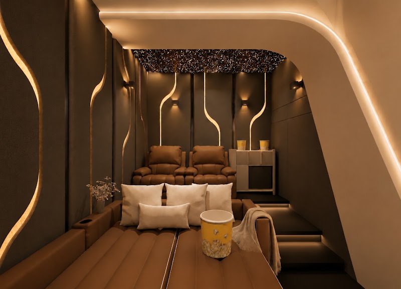 Home theater design in Indore with tiered recliner seating