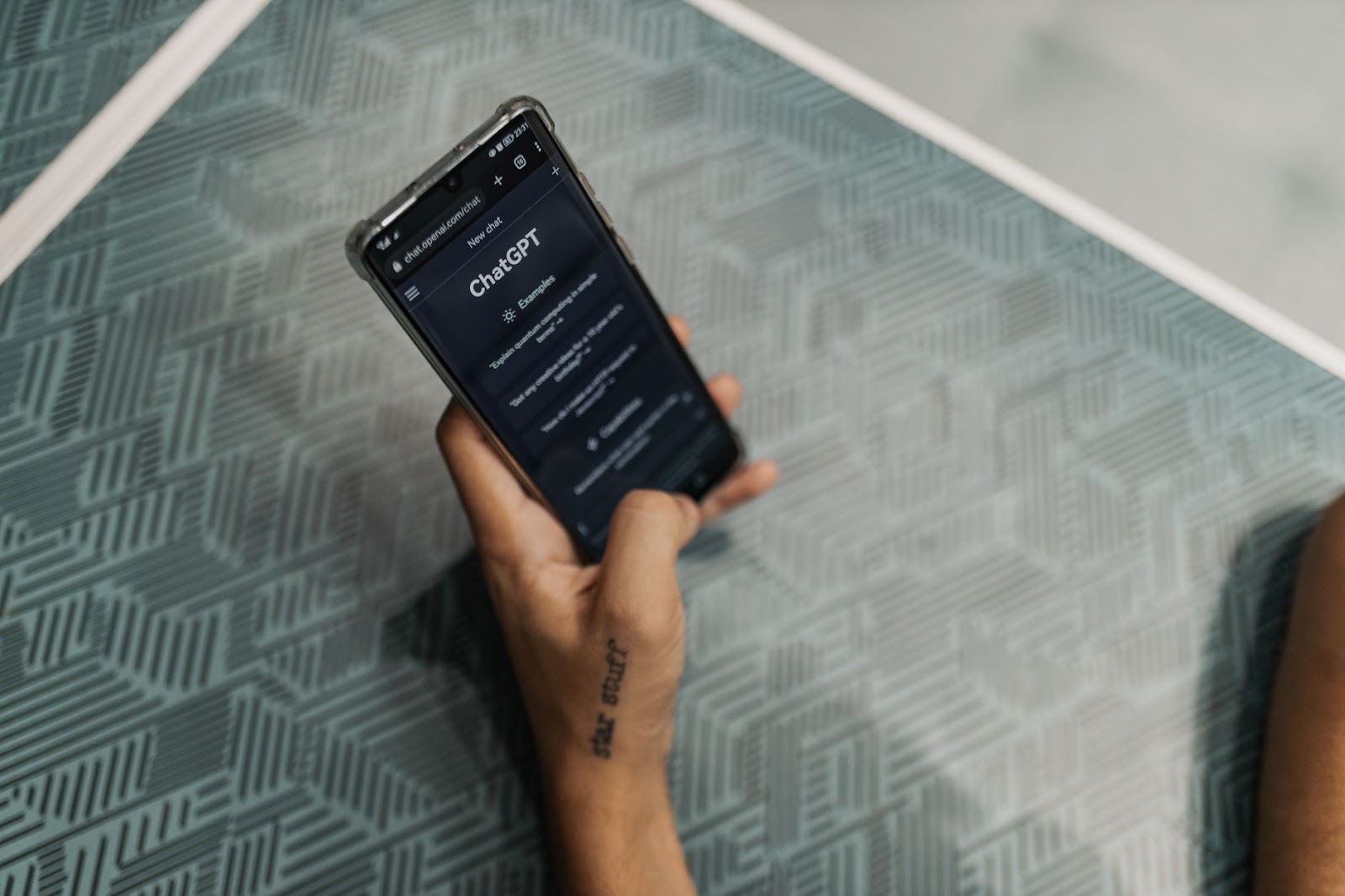 Holding a phone with ChatGPT open