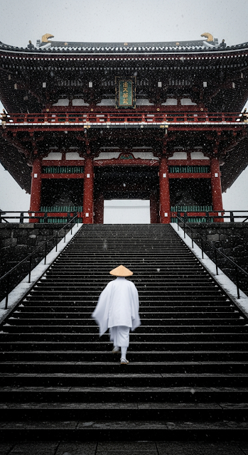Monastic Figure Ascending Steps to a Red Japanese Temple Gate in Heavy Snowfall - Free mobile Wallpaper
