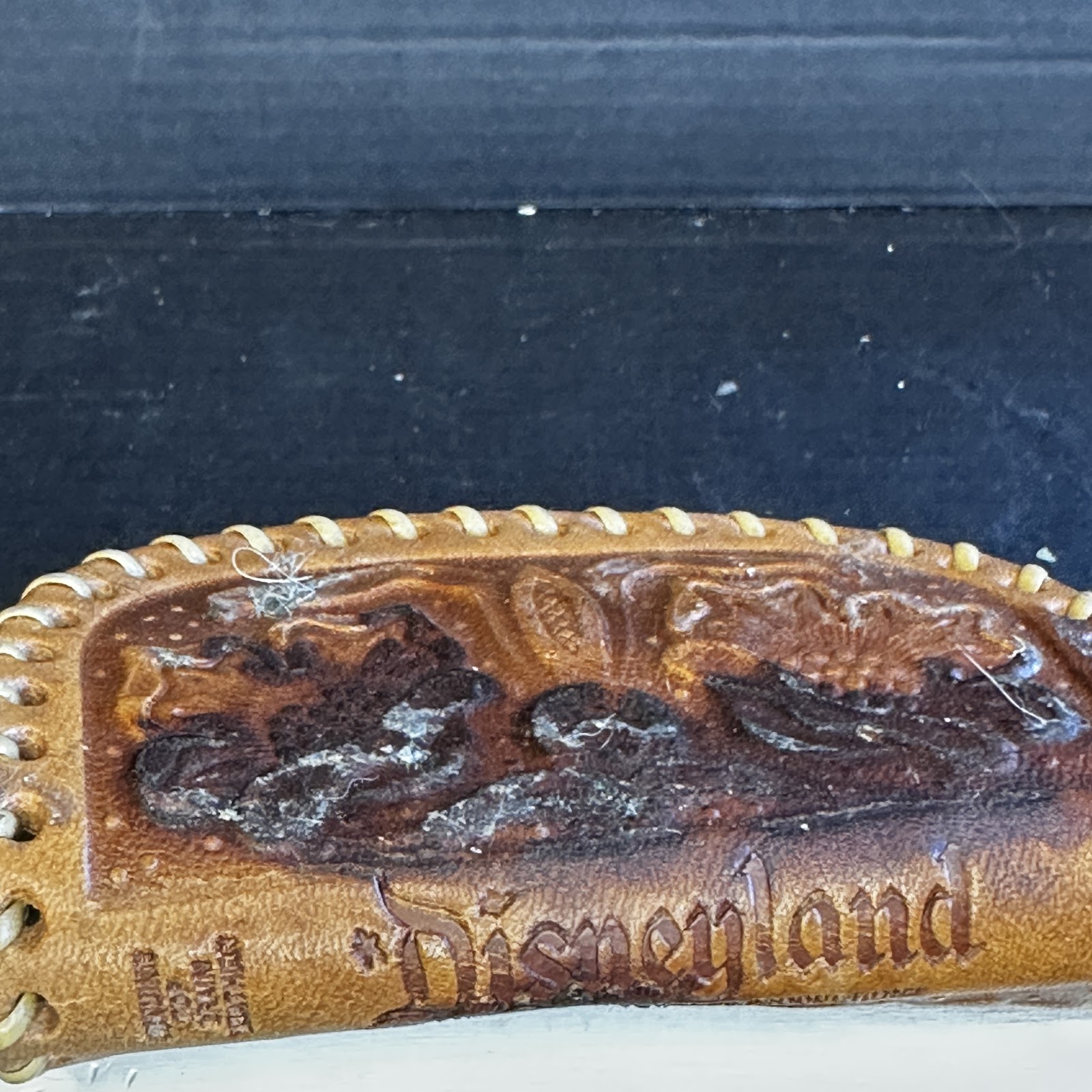 Vintage hand-tooled genuine cowhide Disneyland souvenir wallet with Mickey Mouse design, circa 1955–1965