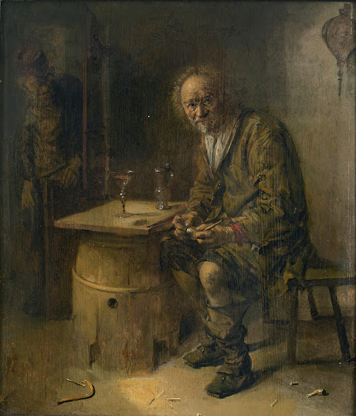 A man seated in an interiorwith a pipe