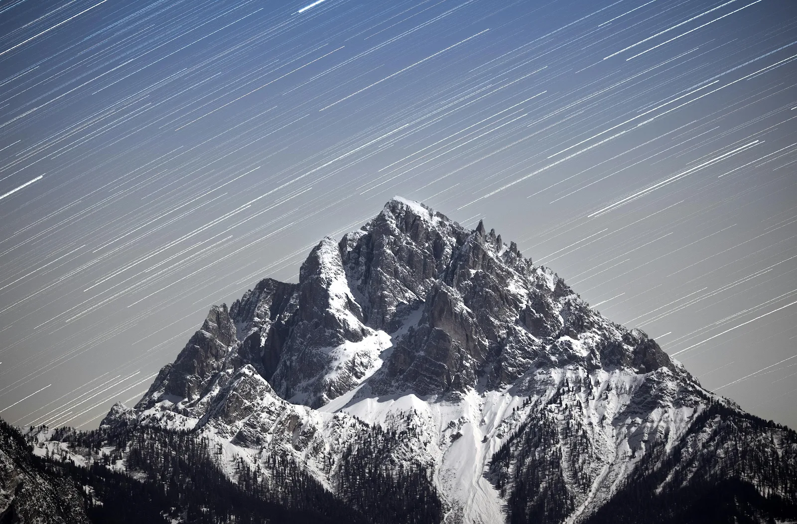 Star Trails Over Snowy Peak - Long Exposure Photography 4K Wallpaper (4000x2628)