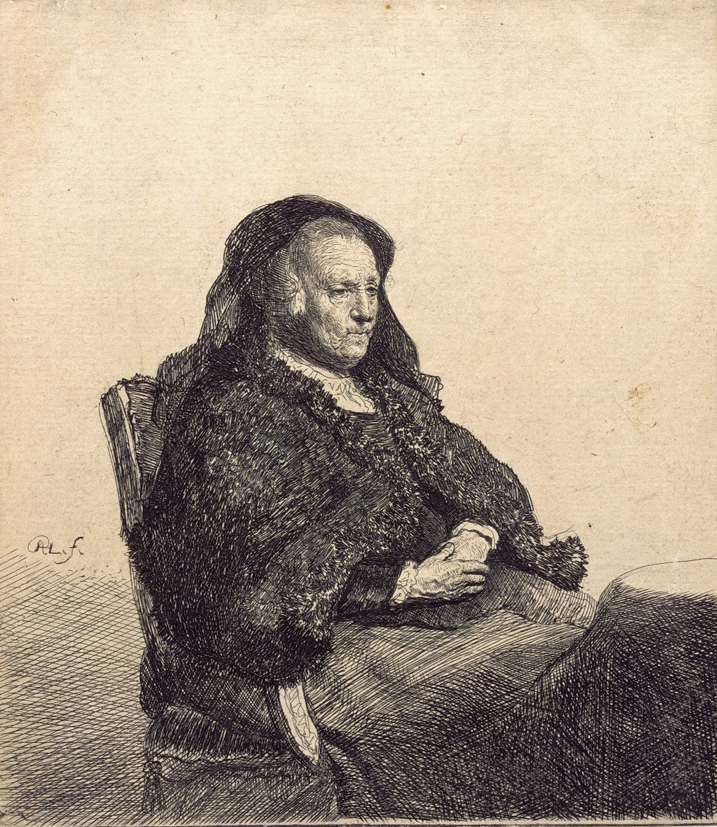 An Elderly Woman Rembrandts mother seated at a table c 1631
