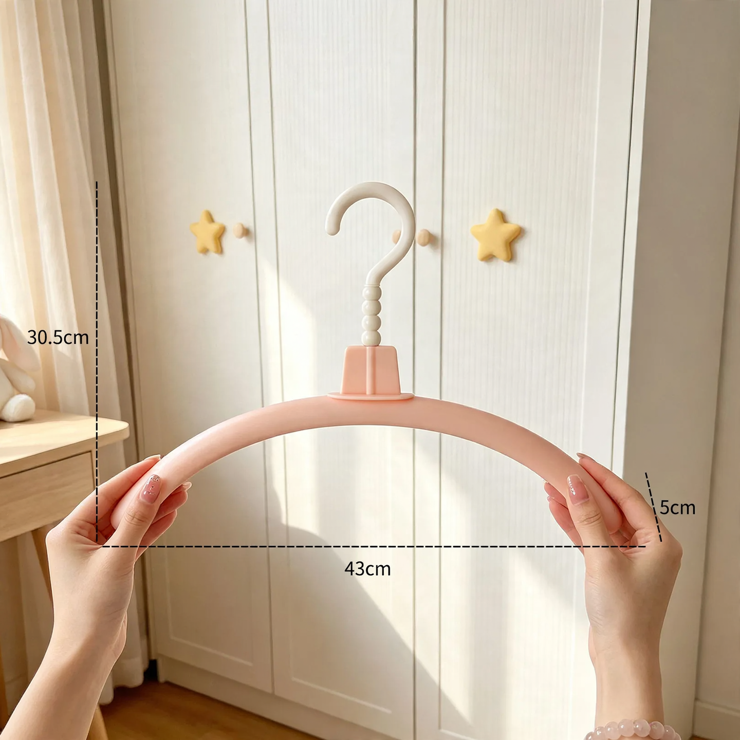 Plastic hanger with monster design
