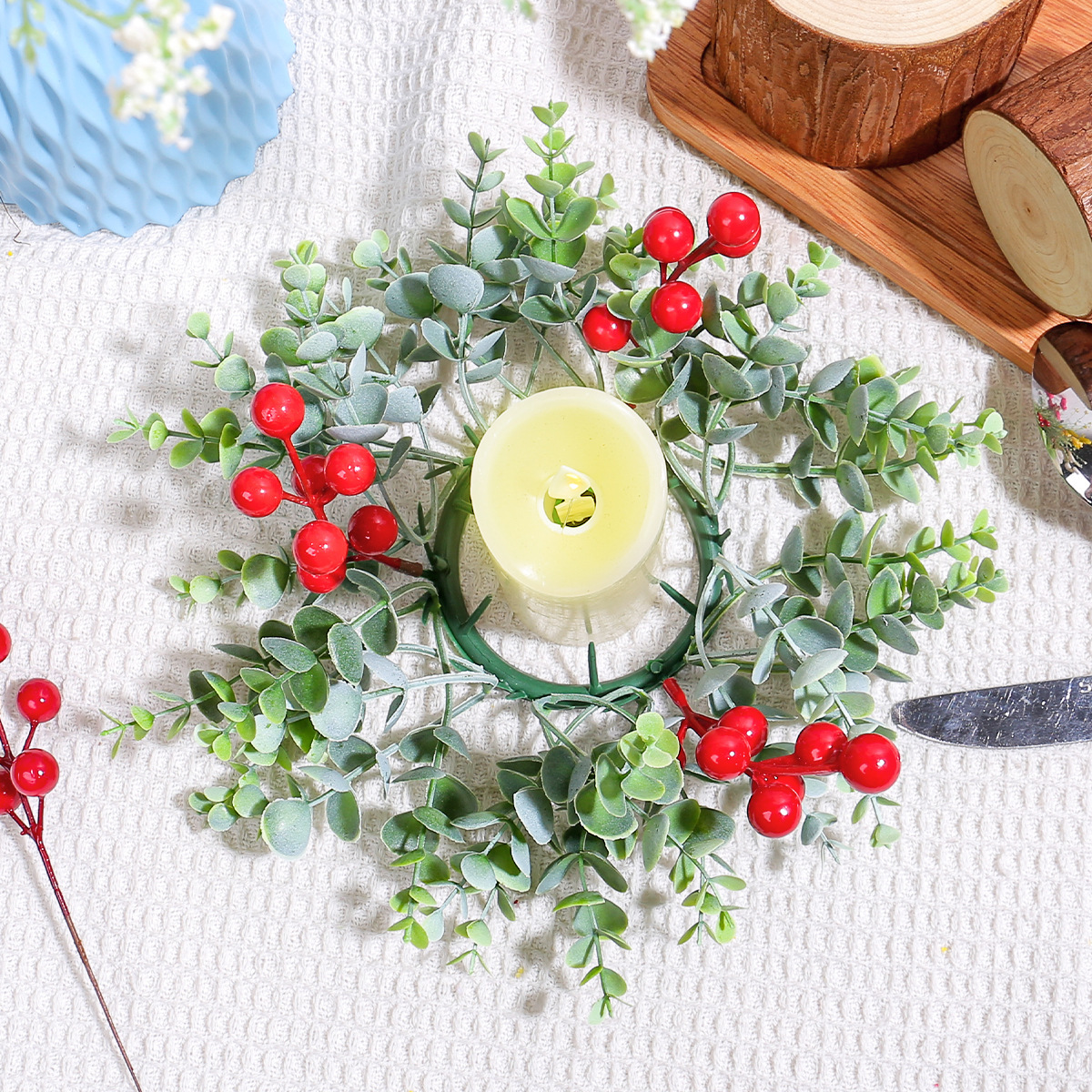 Christmas candle wreath with red berries