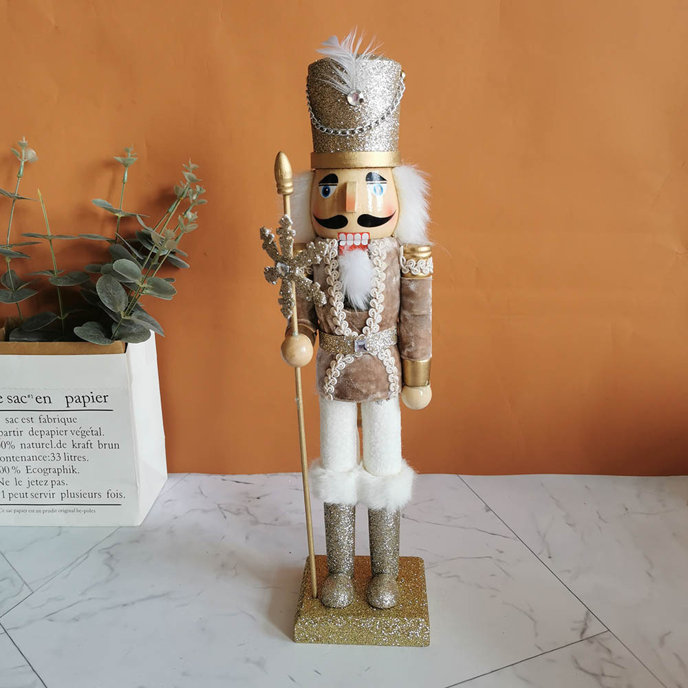 Decorative wooden nutcracker figure with snowflake design
