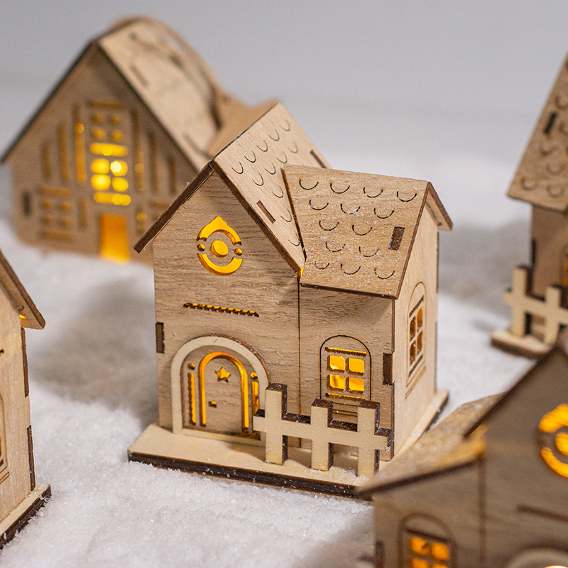Illuminated wooden house for Christmas decoration