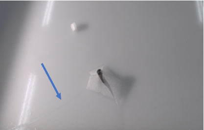 Investigation on the Ice Load on a Cylinder Vertically Breaking through Model Ice Sheet from Underneath