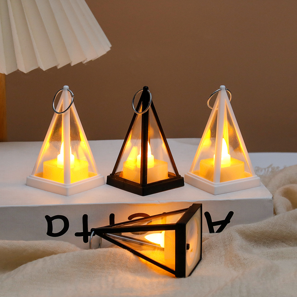 Decorative LED lantern in triangular design for festive occasions